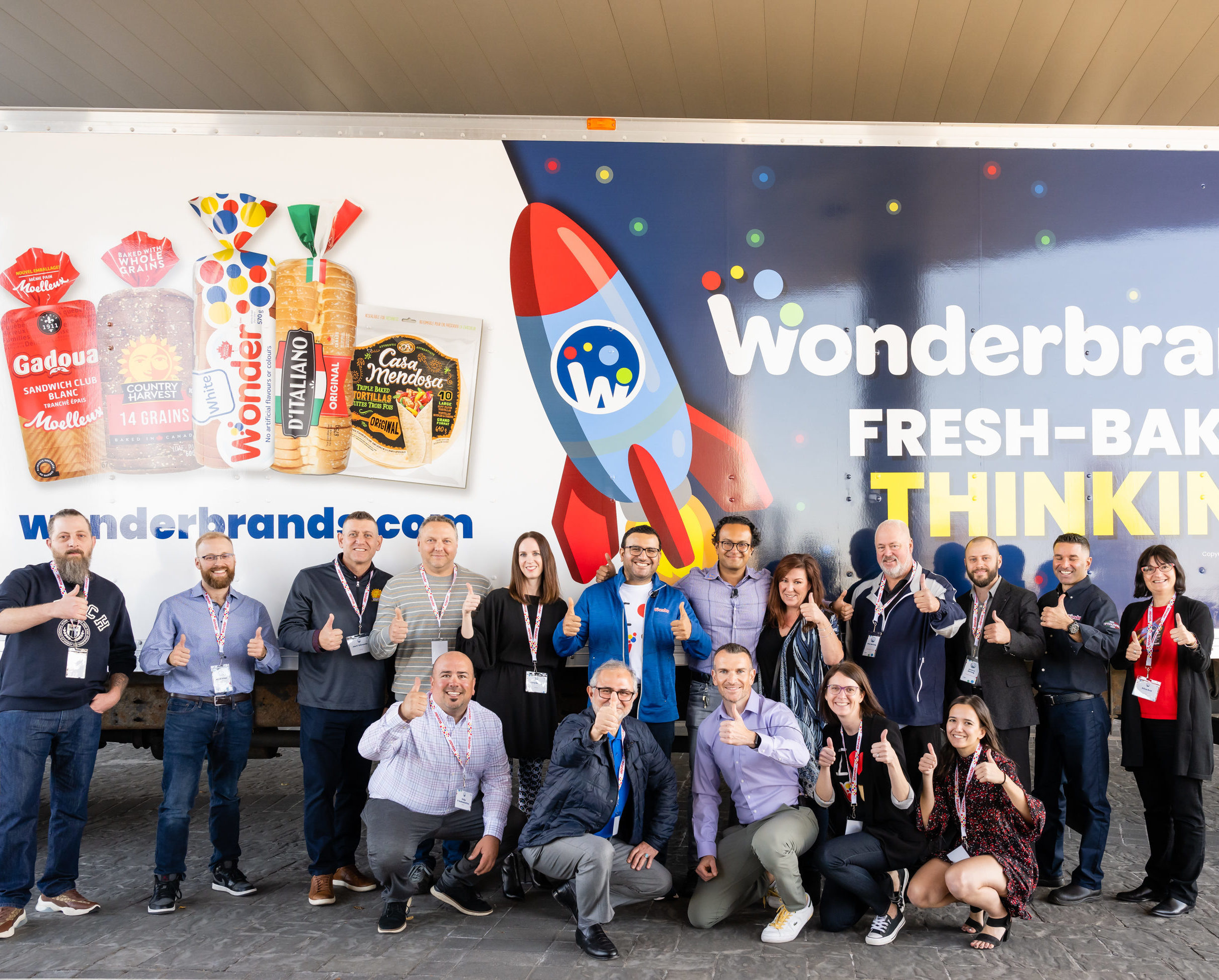 Wonderbrands Team Members in front of new Wonderbrands Truck